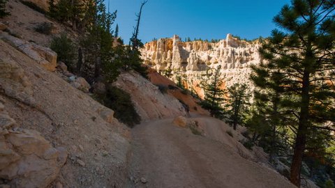 Video in motion along the trail on the top of the mountains. Walk along the path. Nature video. Amazing mountain landscape. Bryce Canyon National Park. Utah.USA. 4K, 3840*2160, high bit rate