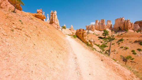 Bryce Canyon National Park. Utah. USA. August 30, 2017: People walking along the trail. Sunny day in the Bryce Canyon National Park. Nature video. Amazing mountain landscape. 