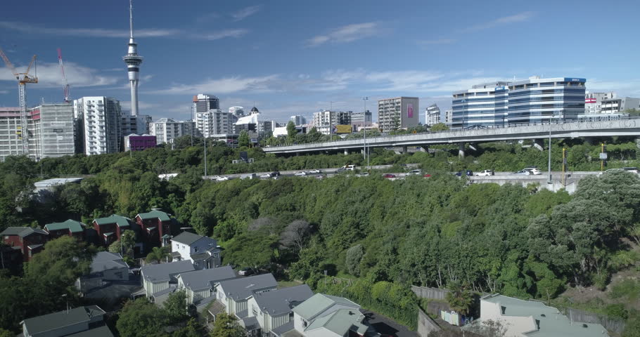 Aerial Auckland City Skyline, skytower and congested motorway traffic, New Zealand