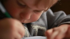 Video baby kid learns to write pen on paper