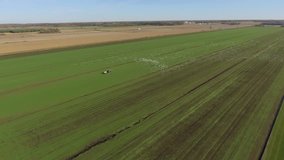 aerial tractor on sod farm drives snow geese away unique video footage