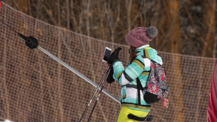 Female skier on a drag lift, Belokurikha resort