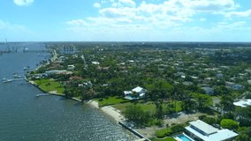 Aerial residential neighborhood in West Palm Beach approaching Southern Boulevard Bridge Intracoastal