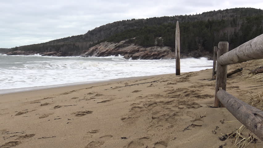 Waves crashing and wind blowing on Sand Beach in Acadia National Park