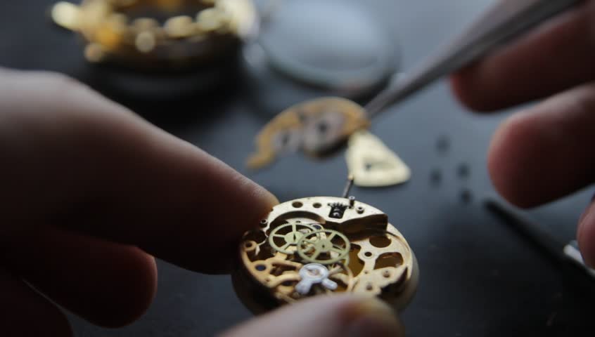 Watchmaker is repairing the mechanical watches in his workshop | Shutterstock HD Video #1008671518