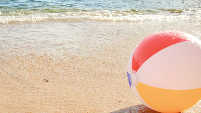 Beach Ball at the Mercy of the Waves. The sea dragging a beach balloon and returns it to the shore.

 Royalty-Free Stock Footage #1008671917