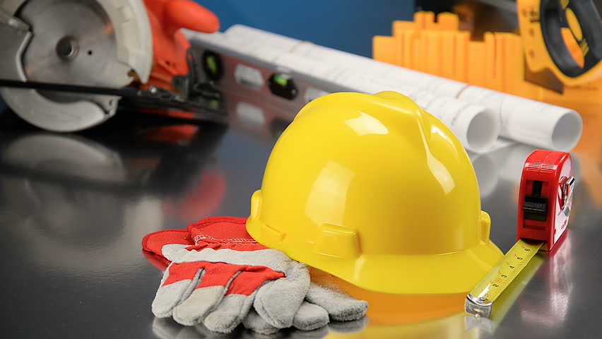 Construction Gear on Tabletop with Hardhat  Royalty-Free Stock Footage #1008672688