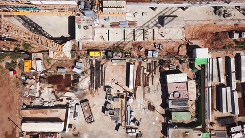 Large construction site during work hours - Top down aerial footage
