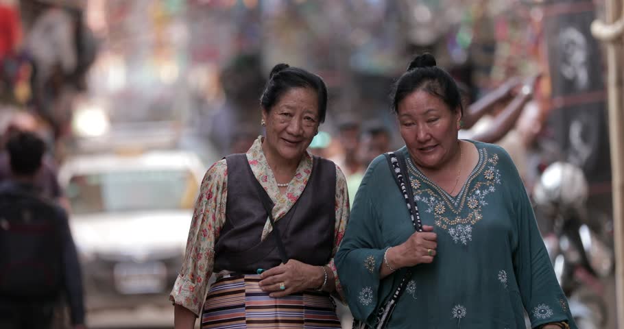 KATHMANDU, NEPAL - 29 May 2017: People of Nepal cityscape market street Durbar Square kathmandu boudhanath stupa. Crowd of people walking on busy street in Tibet