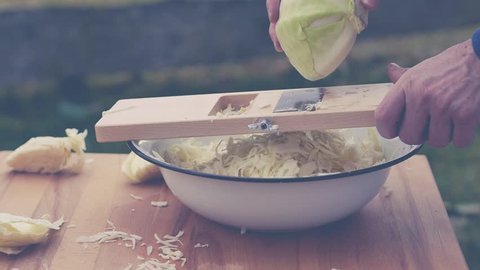 hd video shows how to slice cabbage for homemade sauerkraut with cabbage shredder
