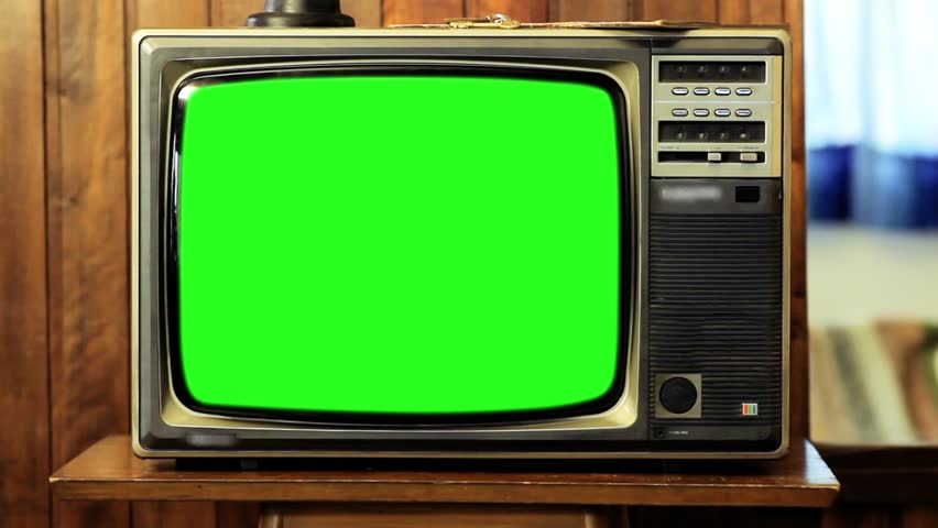 80s TV Green Screen in a Living Room. Zooming Out Slow. You can replace green screen with the footage or picture you want. You can do it with “Keying” (Chroma Key) effect in AE (check out tutorials). | Shutterstock HD Video #1008696169