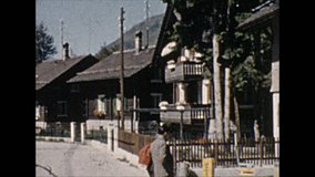 8mm vintage film of chalets, homes and people in switzerland. 1 June 1955