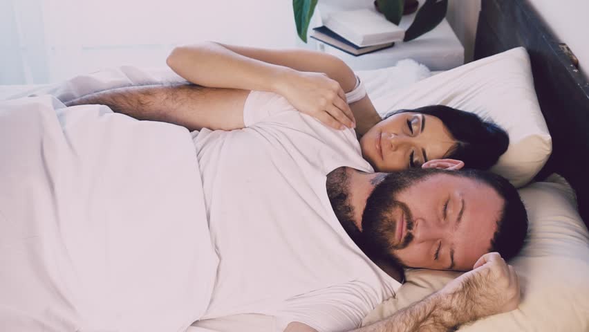 a man and a woman sleeping next to husband and wife Royalty-Free Stock Footage #1008704923