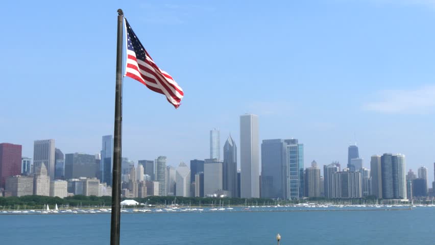 USA flag in front of Chicago skyline