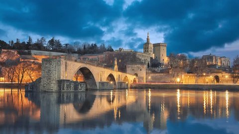 View on Pont d'Avignon 12th century bridge and city skyline in Avignon, Provence, France (static image with animated sky and water)