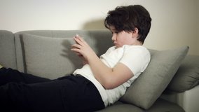 4K Tech-Addicted Child Playing in his Smartphone