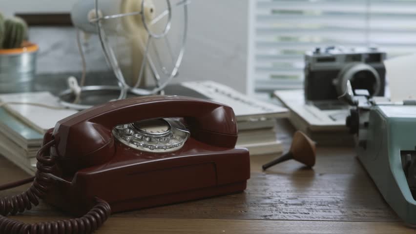 Old fashioned writer and reporter desk with typewriter, vintage camera and record player: creativity and retro revival concept