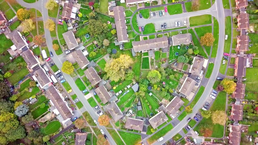 Aerial view of traditional housing estate in England. Looking straight down with a satellite image style, the houses look like a miniature village