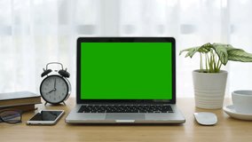 Computer Laptop with green screen display. Dolly in. Perfect to put your own image or video. Track with perspective corner pin.