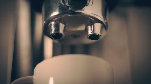Espresso dripping from portafilter of espresso machine