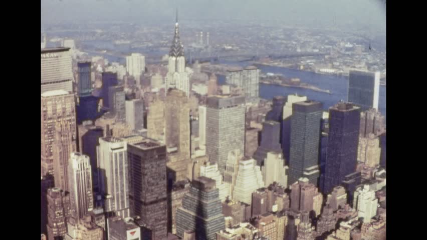New York 1960s: Panoramic view over New York City from the top of a skyscraper, on 1960s in New York, USA Royalty-Free Stock Footage #1008741974