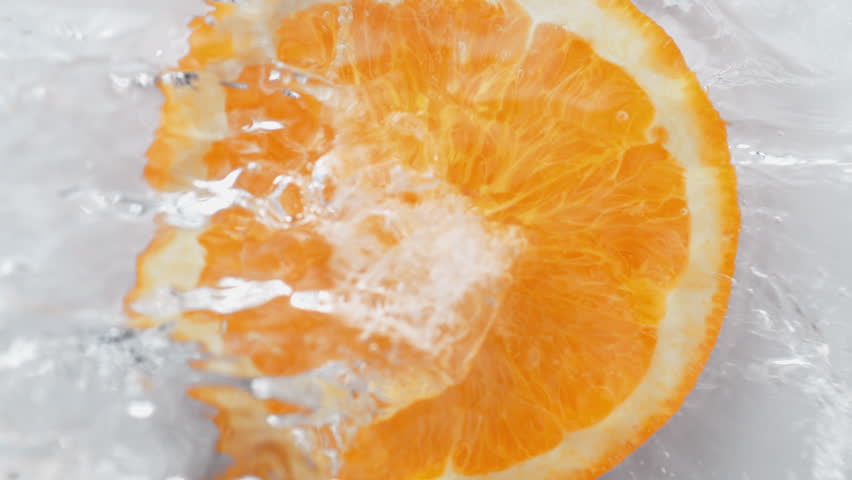 Water splash on halved orange. Shot with high speed camera, phantom flex 4K. Slow Motion. Royalty-Free Stock Footage #1008754856