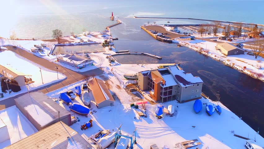 Sunrise flyover view of scenic lakeshore Harbor Town, Algoma, Wisconsin.
