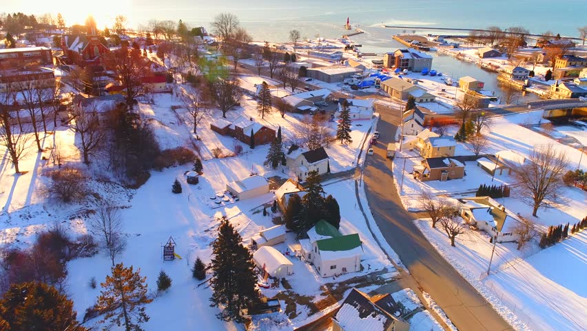 Sunrise flyover view of scenic lakeshore Harbor Town, Algoma, Wisconsin.
