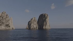 Aerial Drone footage view of Faragioni Rocks in Sea in Capri Naples Costiera Amalfitana Italy Europe  Vesuvio// no video editing