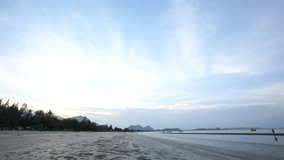 Time lapse of sunset of  Hua Hin beach, Thailand. People walking on the beach