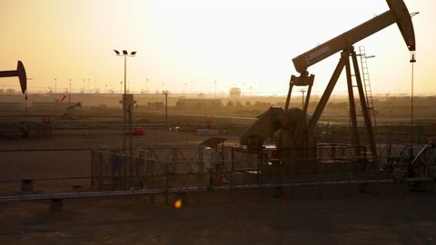 Oil Pumps working at Sunset in Bahrain
