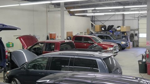 Overview of vehicle repair facility simulating end of day and the start of the work day by turning the lights off and then on.