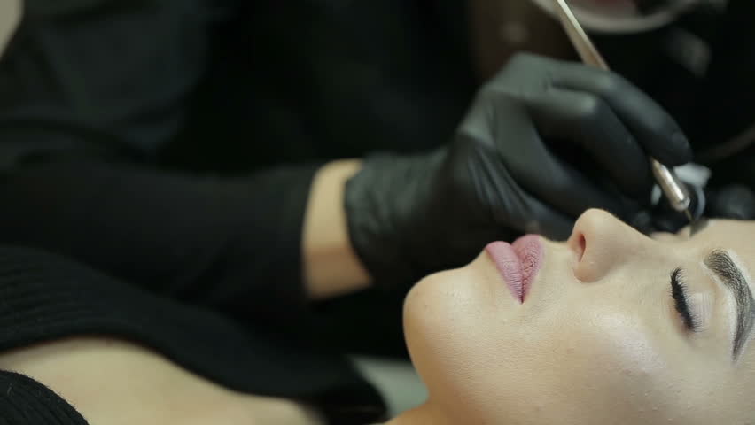Microblading procedure. Master works with the eyebrows. | Shutterstock HD Video #1008806804