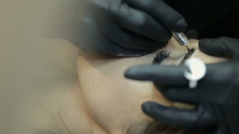 Close up of cosmetologist making permanent makeup.Microblading procedure.