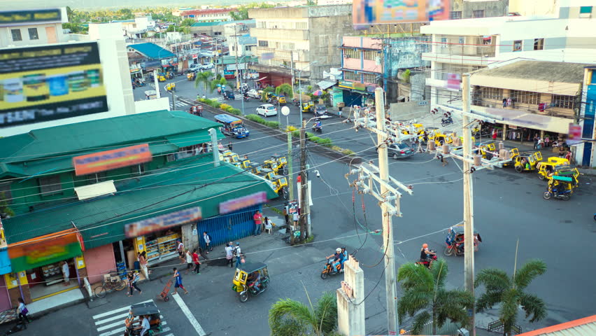 LEGAZPI, PHILIPPINES - JANUARY 5, 2018: Traffic on one of the central streets of the city of Legazpi.