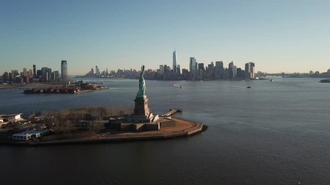 Statue Of Liberty Aerial Moving Forward over Water Toward Manhattan New York City Skyline 4K and 1080 HD NYC