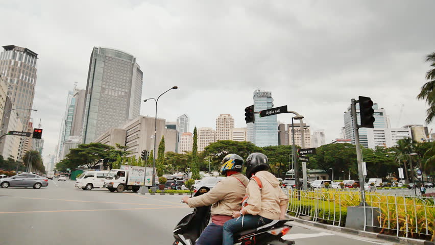 MANILA, PHILIPPINES - JANUARY 5, 2018: Skyscrapers in Manila. Shooting in motion. Makati District in Manila. Philippines.