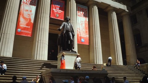 New York City, United States, Circa 2017. Federal Hall National Memorial 
and Wall street full of people. 