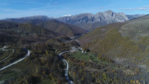 Aerial view of road meandering through mountain landscape in Bosnia and Herzegovina