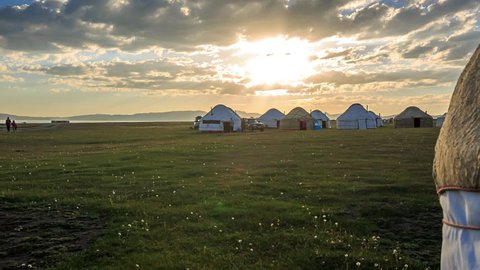 panning shot revealing the environment on Kyrgyz yurt camp in Kyrgyzstan during sunset