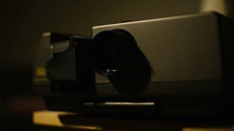 Retro styled slide projector in the dark room