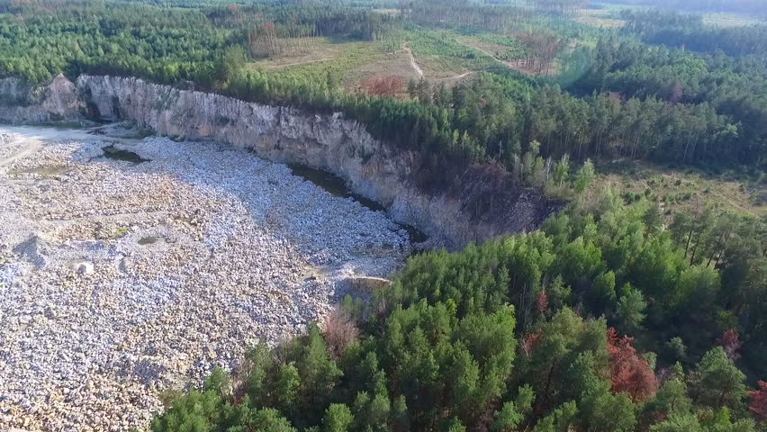 Flight over a granite quarry. Aerial view.