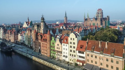 Gdansk, Poland. Aerial  4K flyby video of old city, Motlawa river and famous monuments: Gothic St Mary church, city hall tower, the oldest medieval port crane (Zuraw) in Europe and old houses