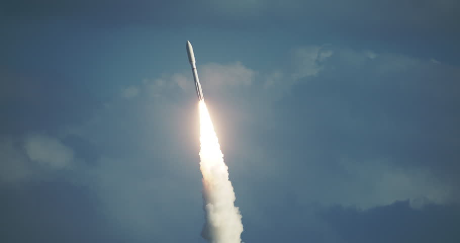 Beautiful close-up shot of commercial Space Rocket lifting off with bright flames and exhaust smoke in front of dramatic sky and clouds. 4K at 120 fps slow motion.