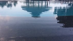 Water surface of a simming pool outdoors with reflection. - Powered by Shutterstock - Get 15% off with code: PIKWIZARD15