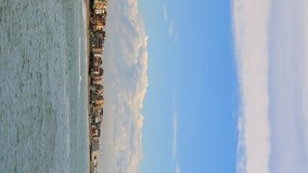 Vertical video. Clouds over the coast. Ostia, Rome, Italy. Time Lapse