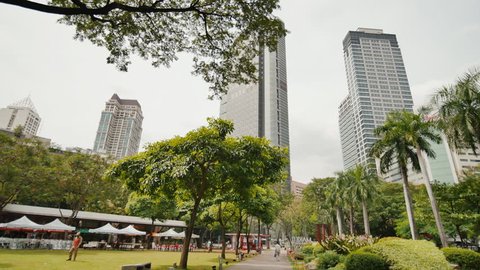 Gardens and skyscrapers seen at Ayala Triangle Park, in Makati, Metro Manila.