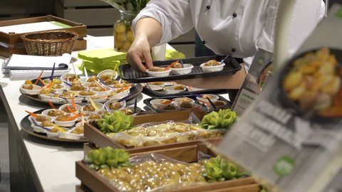 HELSINKI, FINLAND - MARCH 18,2018: The chefs prepare food samples and treat visitors during the Show Gastro Helsinki - big trade fair for the hotel, restaurant and catering industry