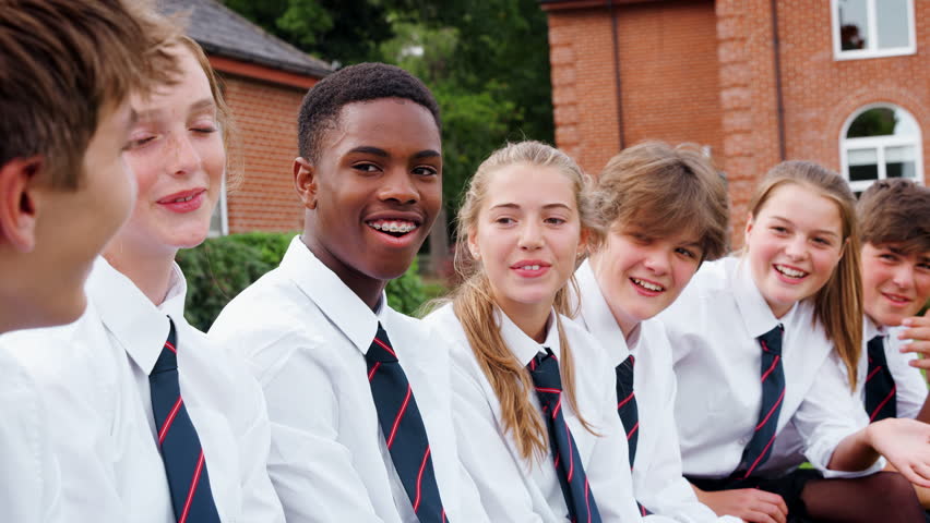 teenage students uniform socializing outside school Stock Footage Video ...