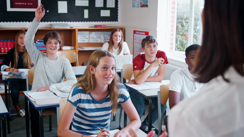 Teenage Students Raising Hand To Ask Question In Classroom | Shutterstock HD Video #1008875285